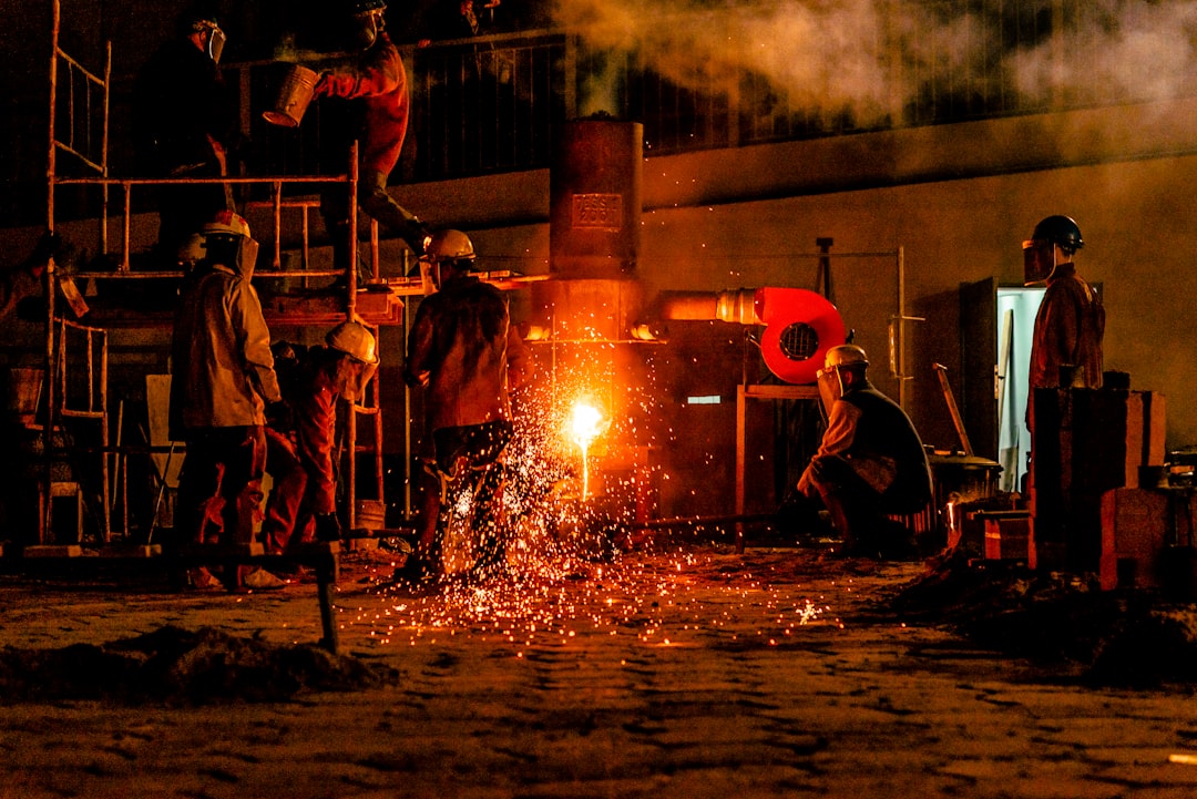 construction men front of fire,