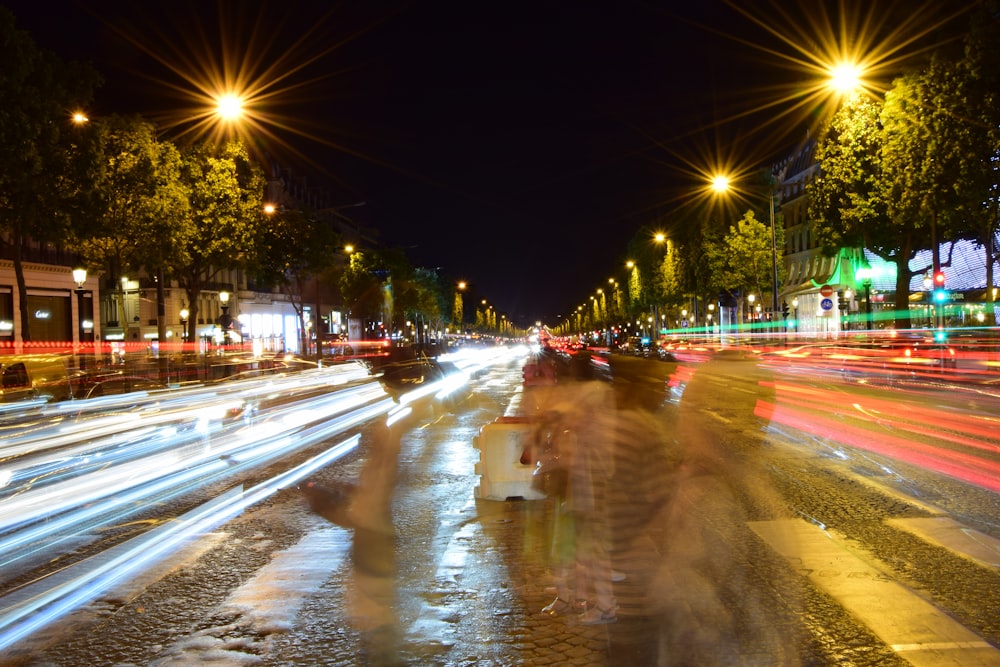 timelapse photo of people crossing pedestrian