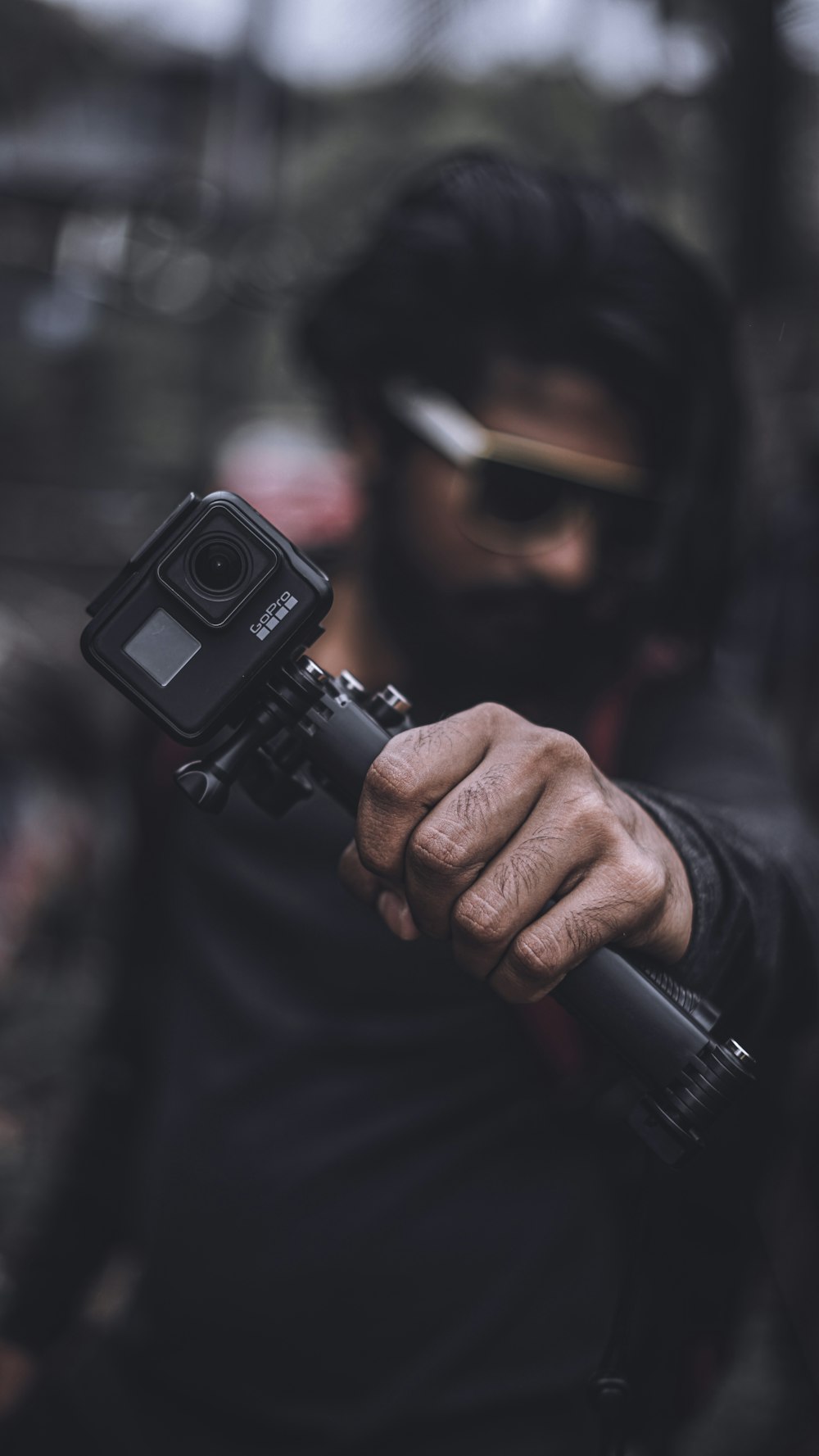 man holding action camera