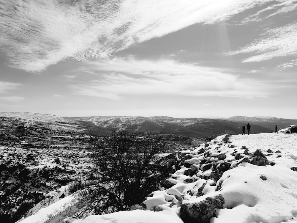 grayscale photography of hills covered by snow