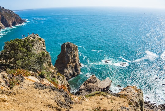 rocks near body of water in Sintra-Cascais Natural Park Portugal