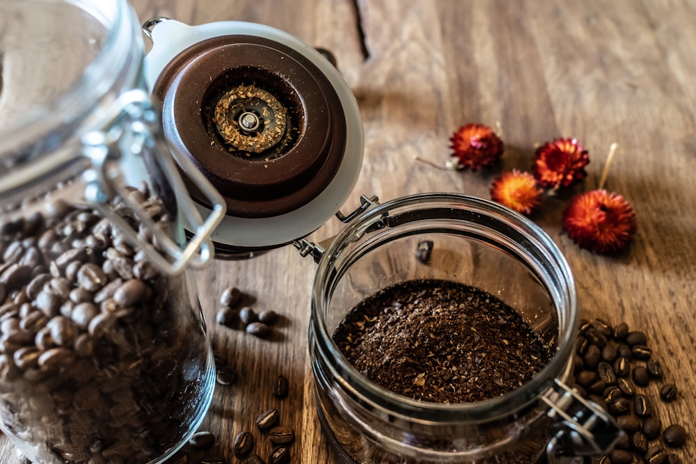 clear glass jar filled with coffee bens