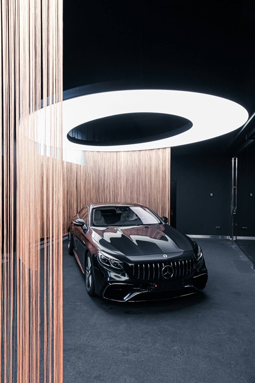black Mercedes-Benz car inside room