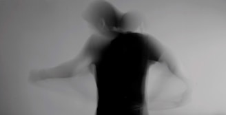 a blurry image of a person standing in a room
