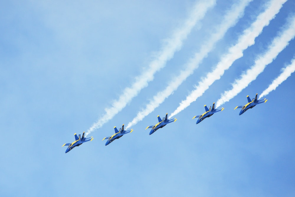 three aircraft with contrails