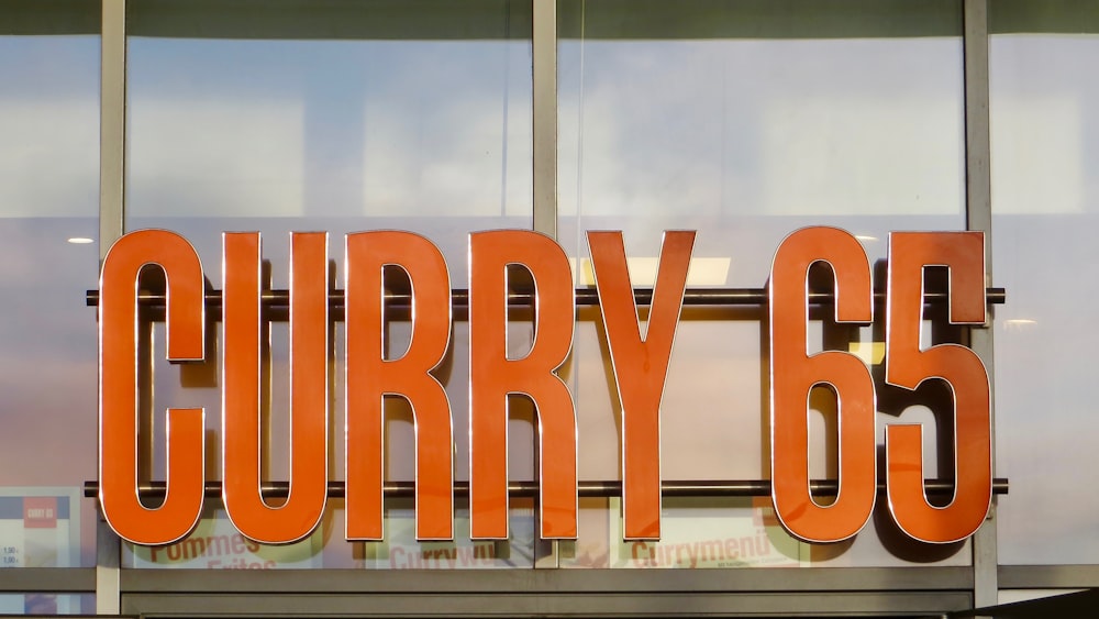 orange Curry 65 sign