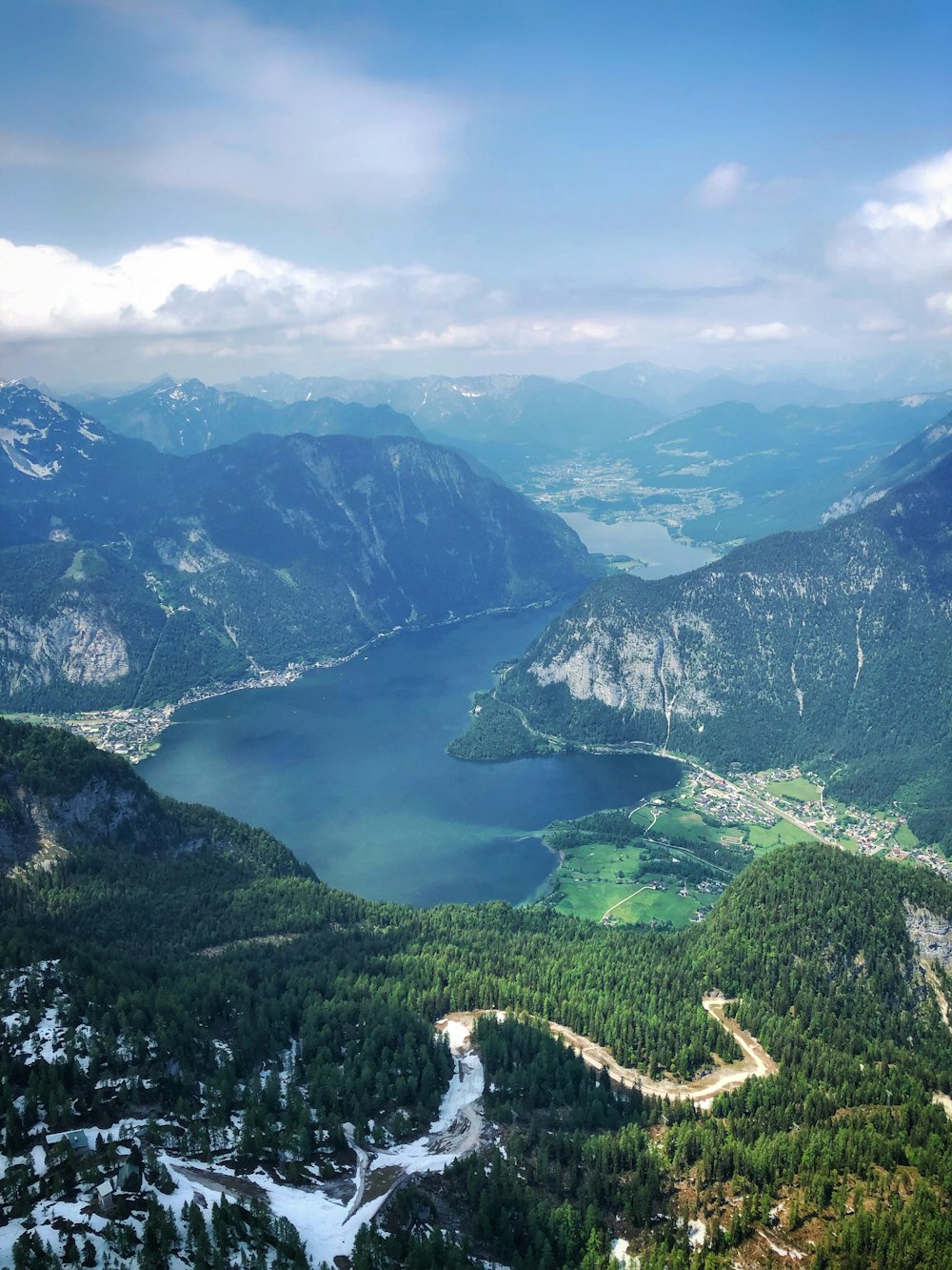 aerial view of mountain beside calm body of water