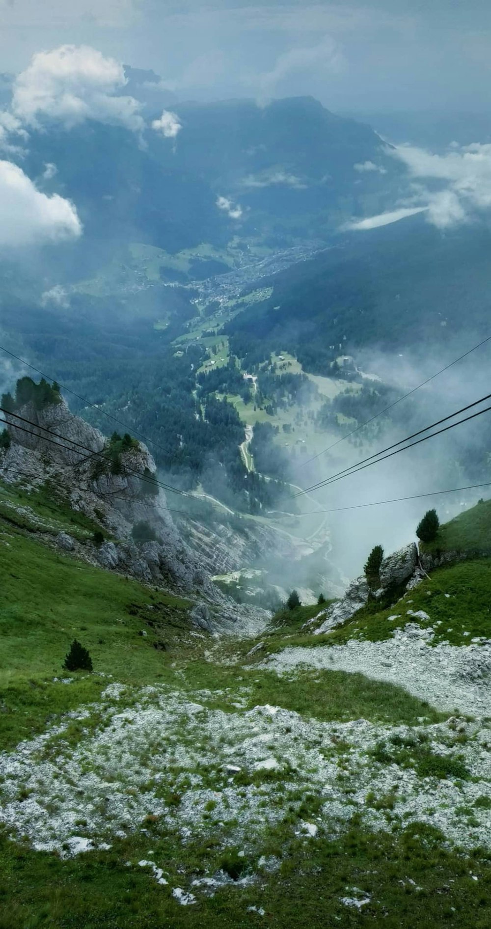 a view of a valley with a mountain in the background