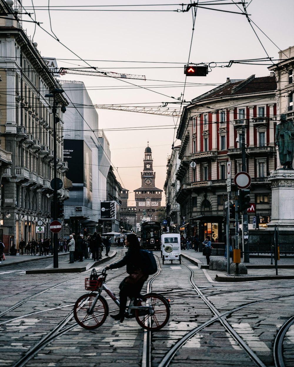 person sitting on bicycle during daytime