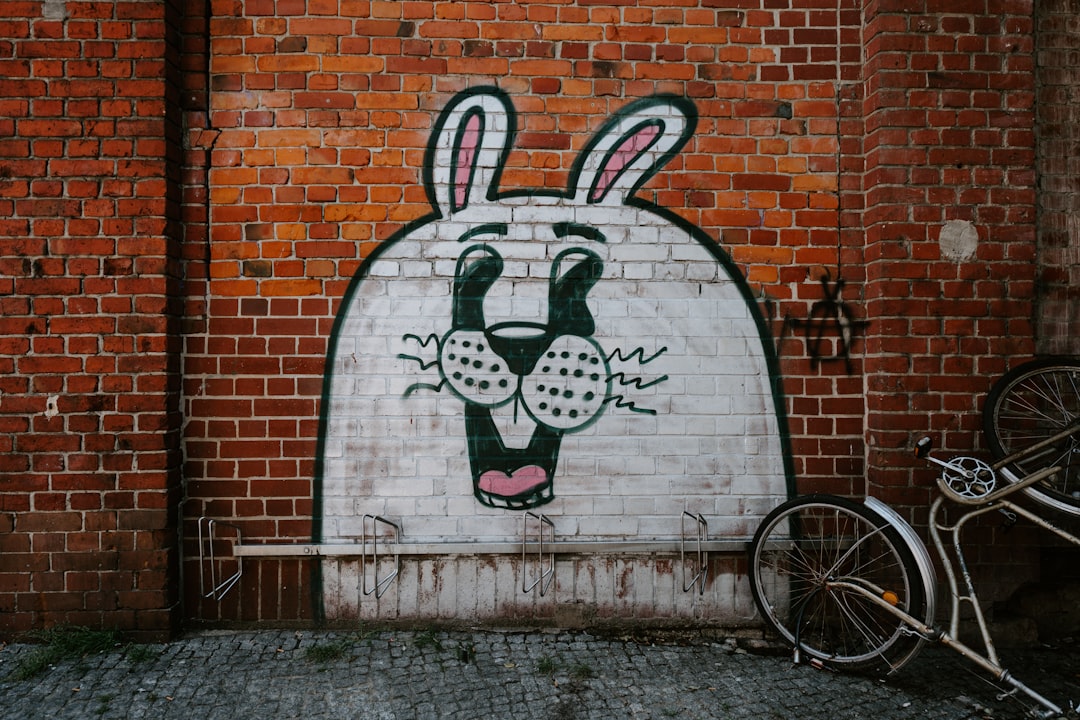 white, black, and pink bunny wall art