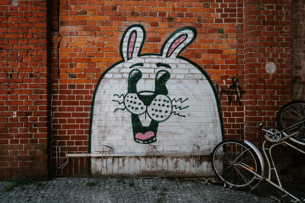 white, black, and pink bunny wall art