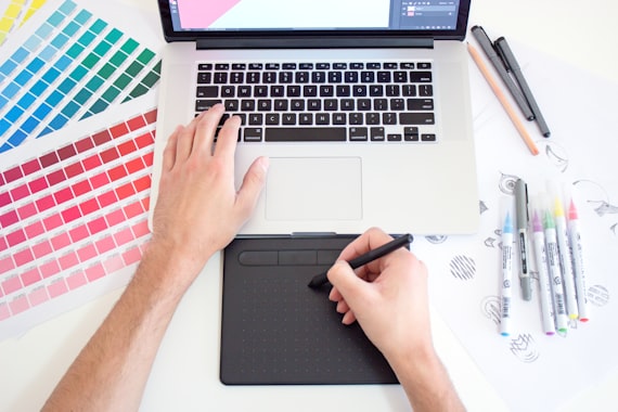 Designer creating product packaging artwork and dieline layout