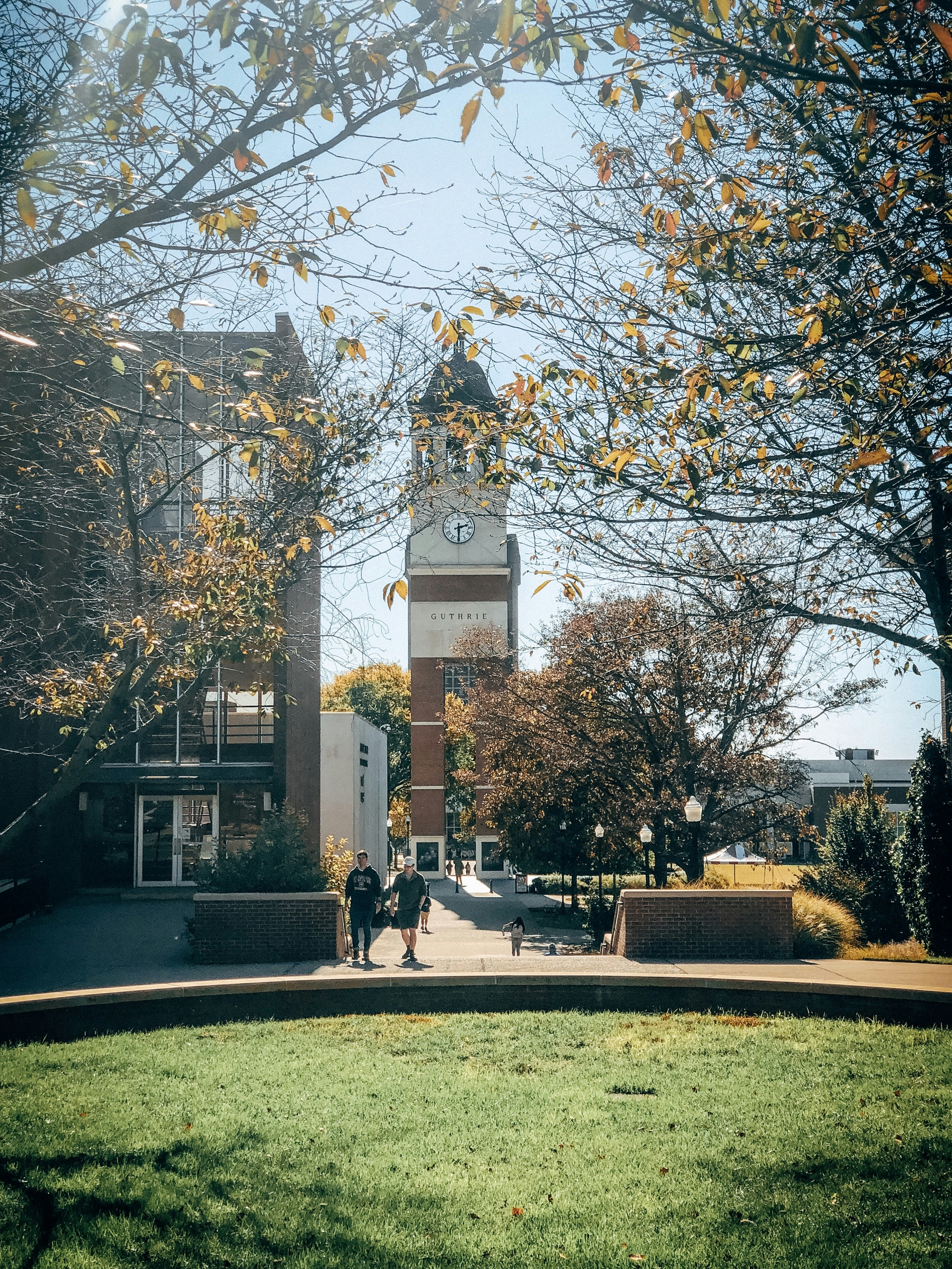 two men near brown building