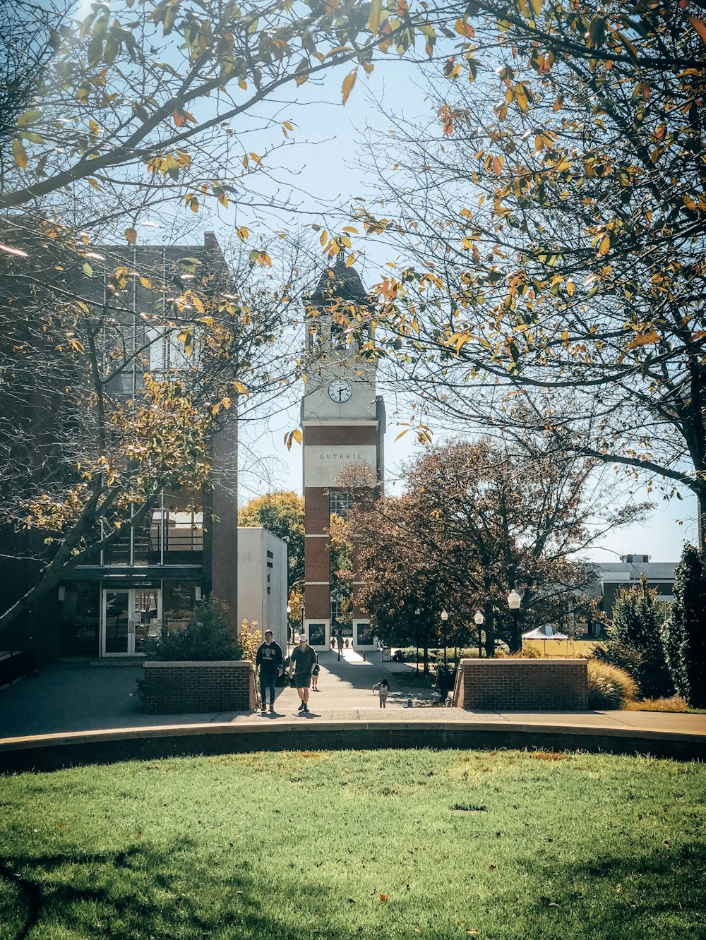 two men near brown building