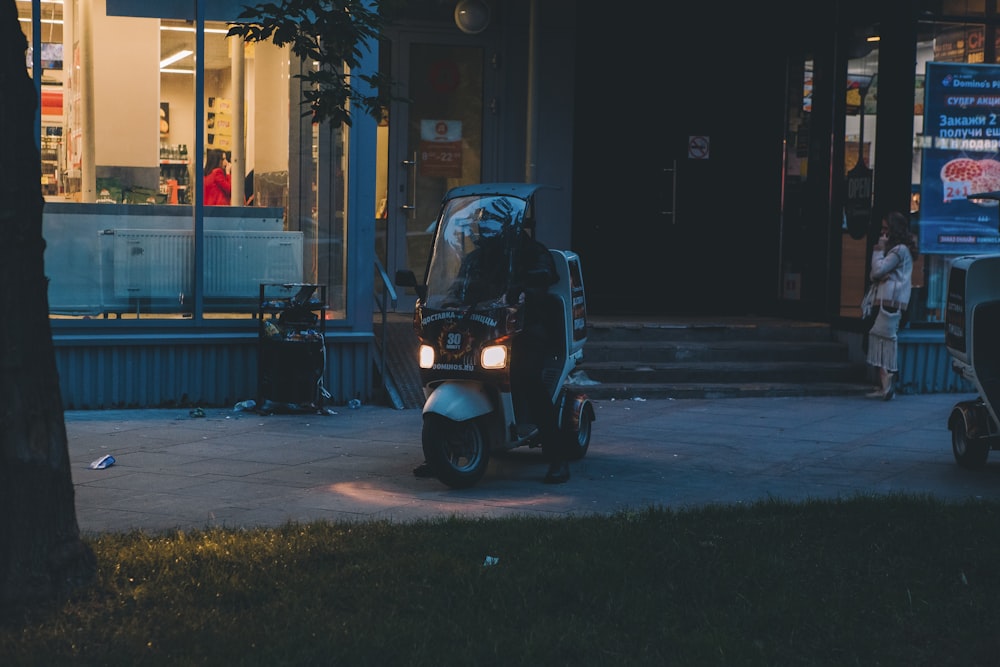 person riding motorcycle near building