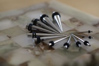 Close-up of sharp spiked shoes designed for resin applications.