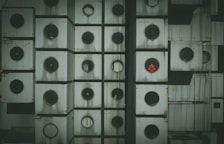 Exterior shot of the modular capsule hotel setup in an urban environment.