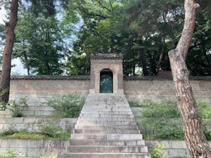 A serene entrance gate surrounded by lush greenery welcoming residents.