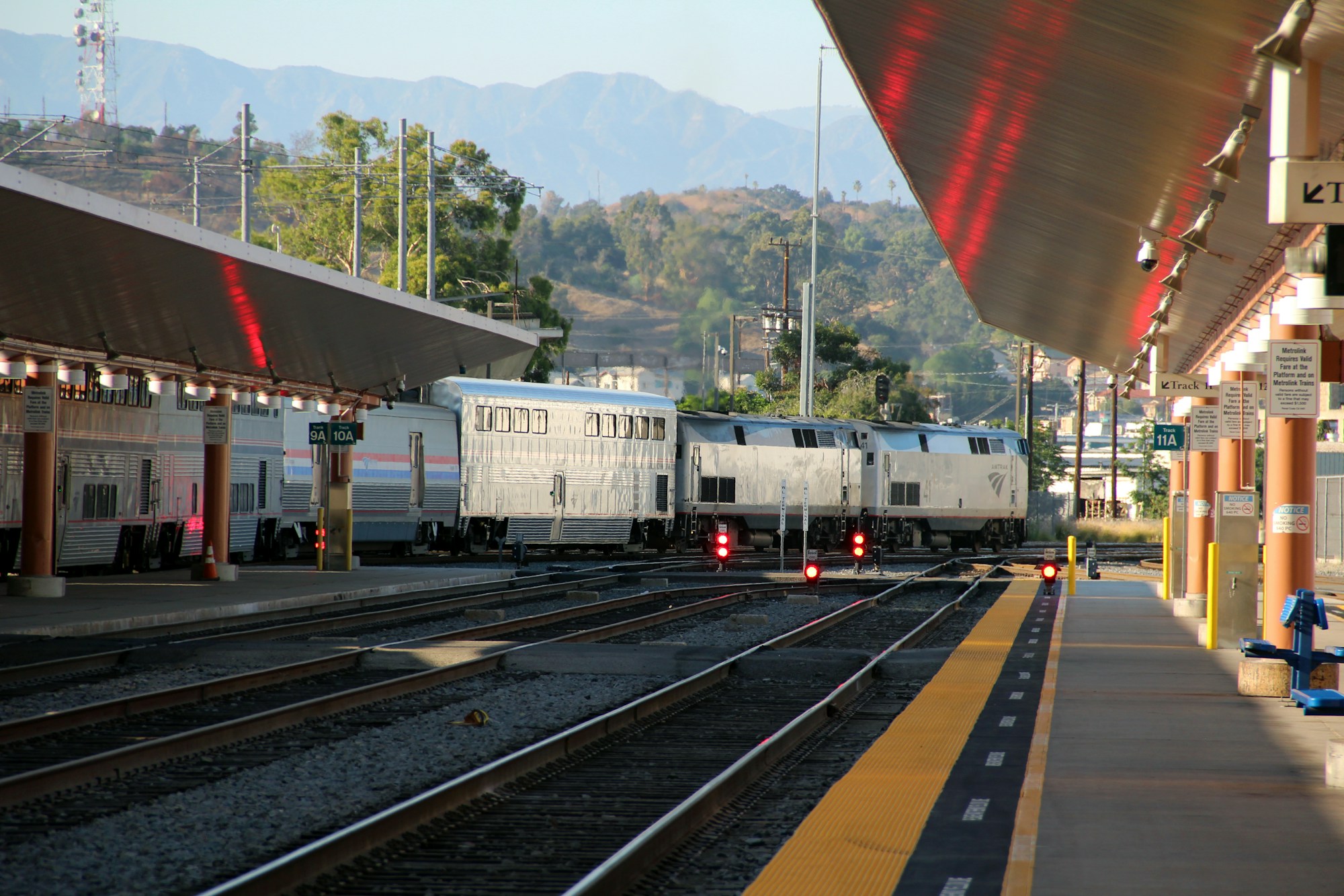An Amtrak train departing a station platform