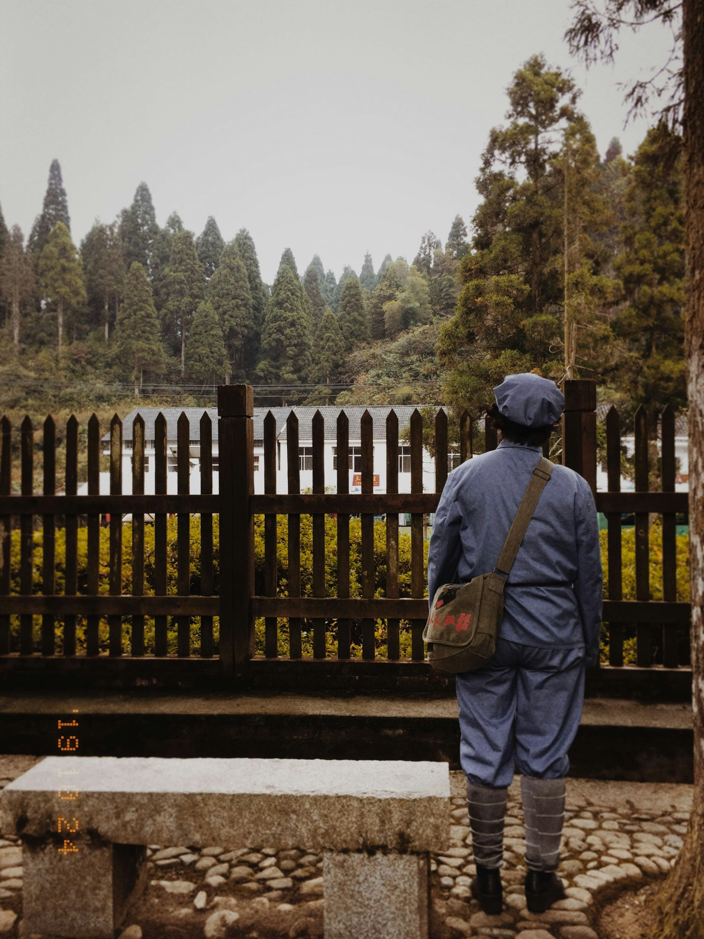person standing near concrete bench during daytime