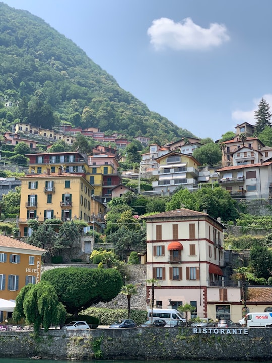 beige painted building near body of water in Lake Como Italy