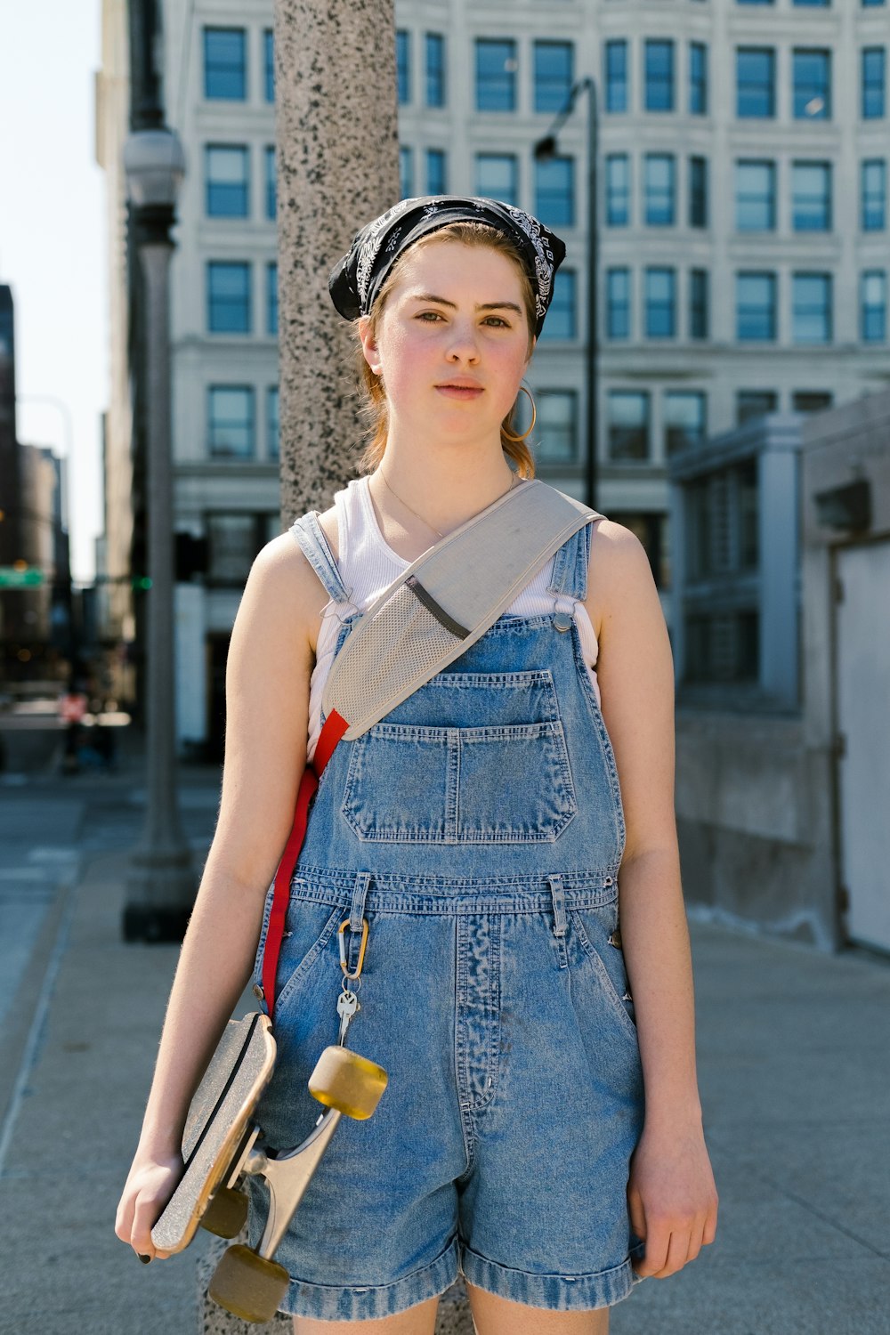 woman in blue denim rompers