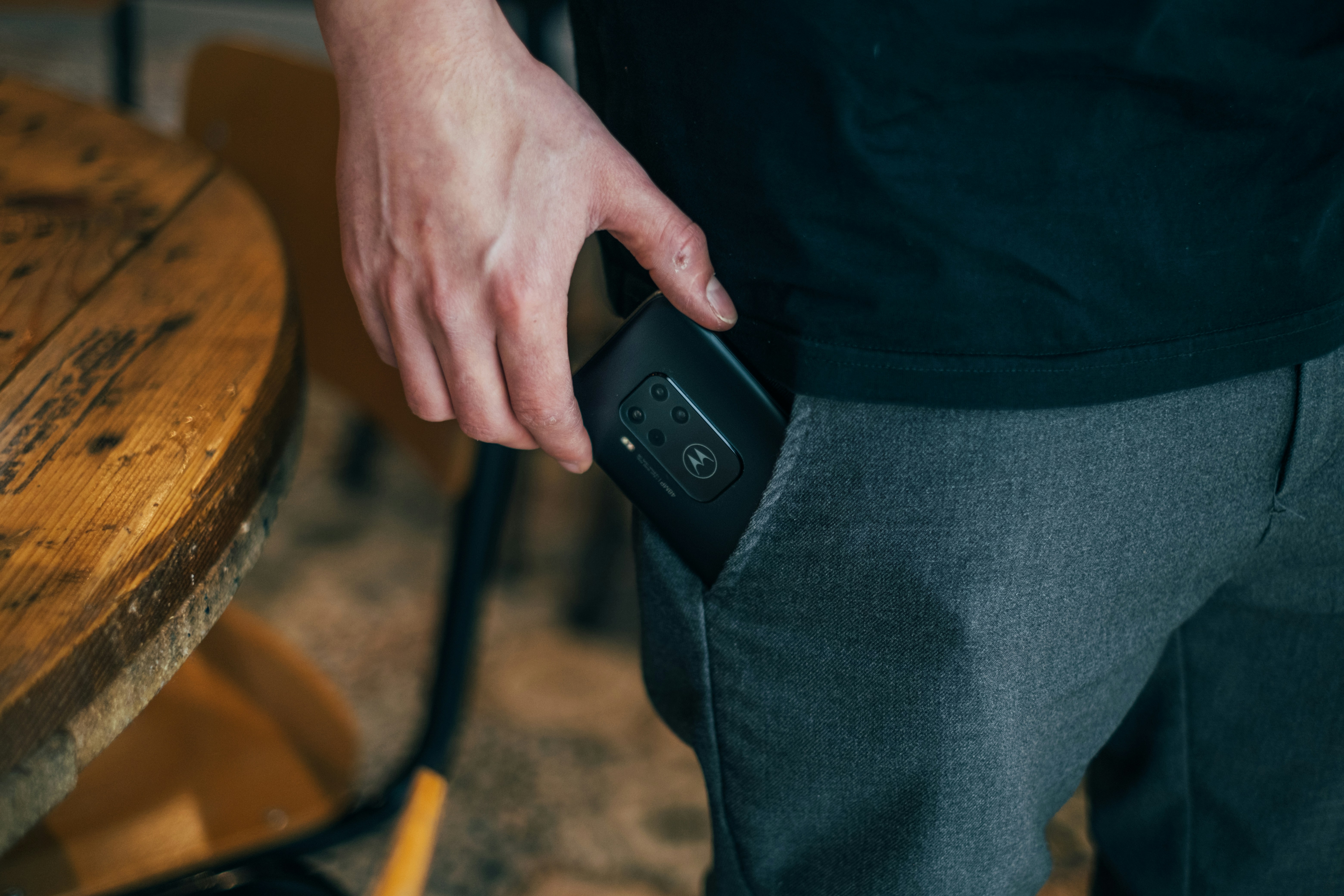 Men taking the Motorola One Zoom out of his pockets. Picture by Jonas Leupe (www.brandstof.studio) for Tandem Tech