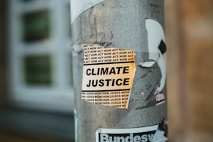 climate justice poster on post