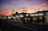 The iconic Atlantic City boardwalk at dusk, setting the stage for a pivotal scene.