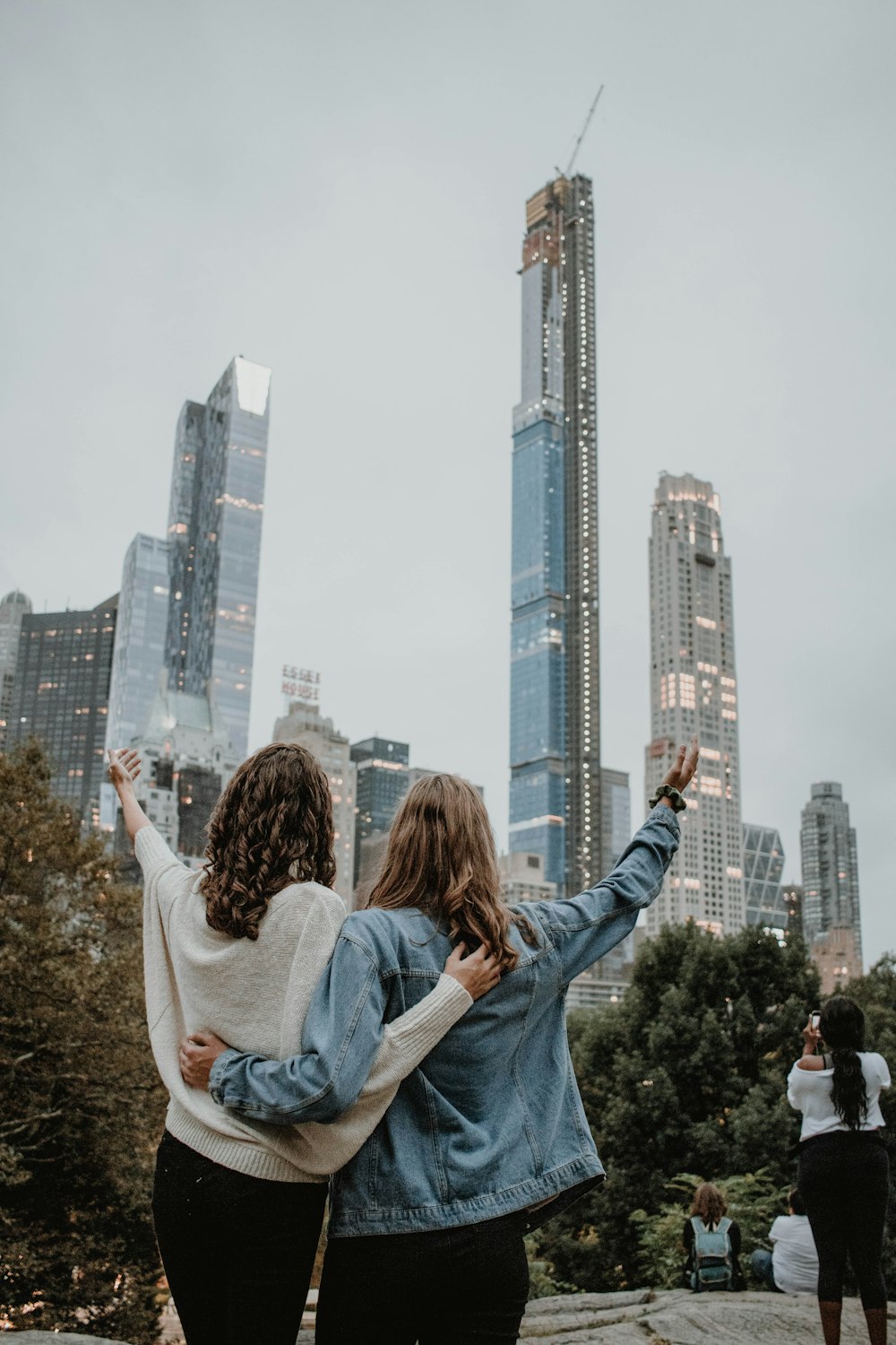 two women in white and blue tops