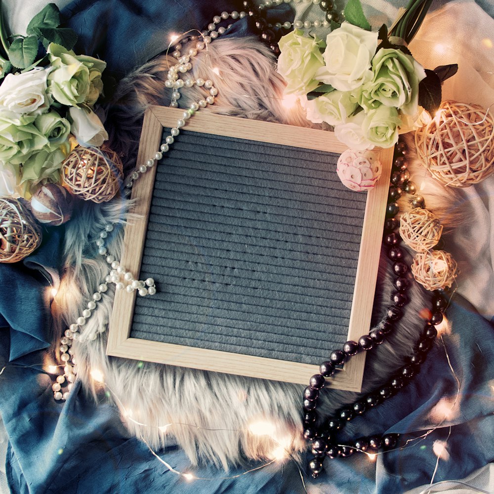 photo frame surrounded by necklaces