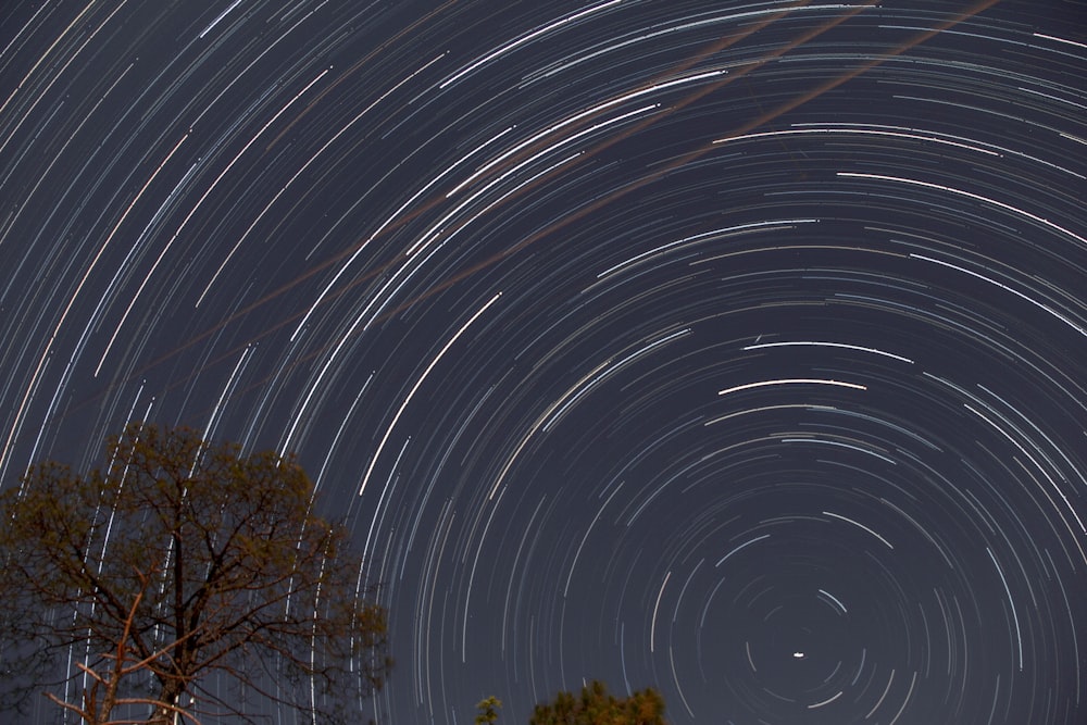 a star trail is seen in the night sky