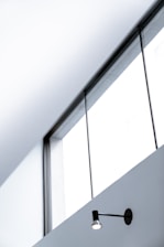 White PVC window installed in a modern living room with natural light.