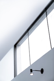 White PVC window installed in a modern living room with natural light.