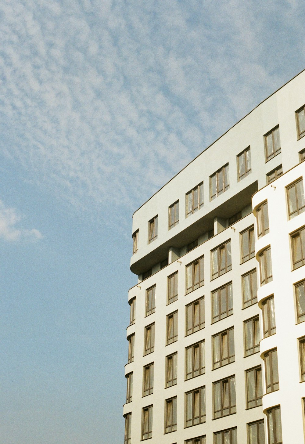 white concrete high-rise building during daytime