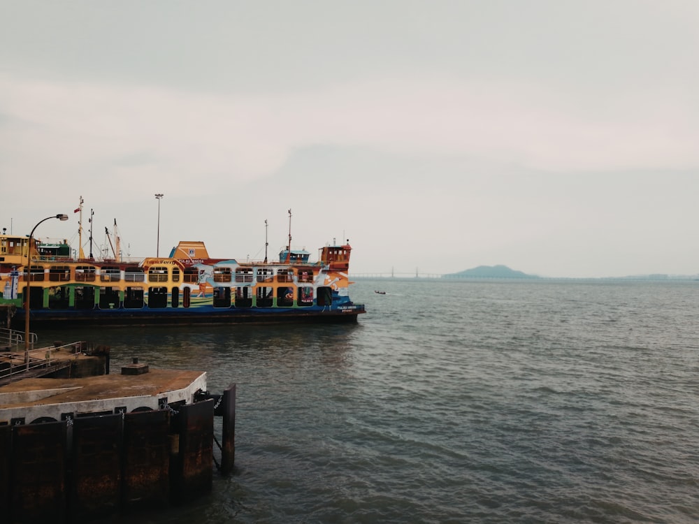 beige ship on body of water