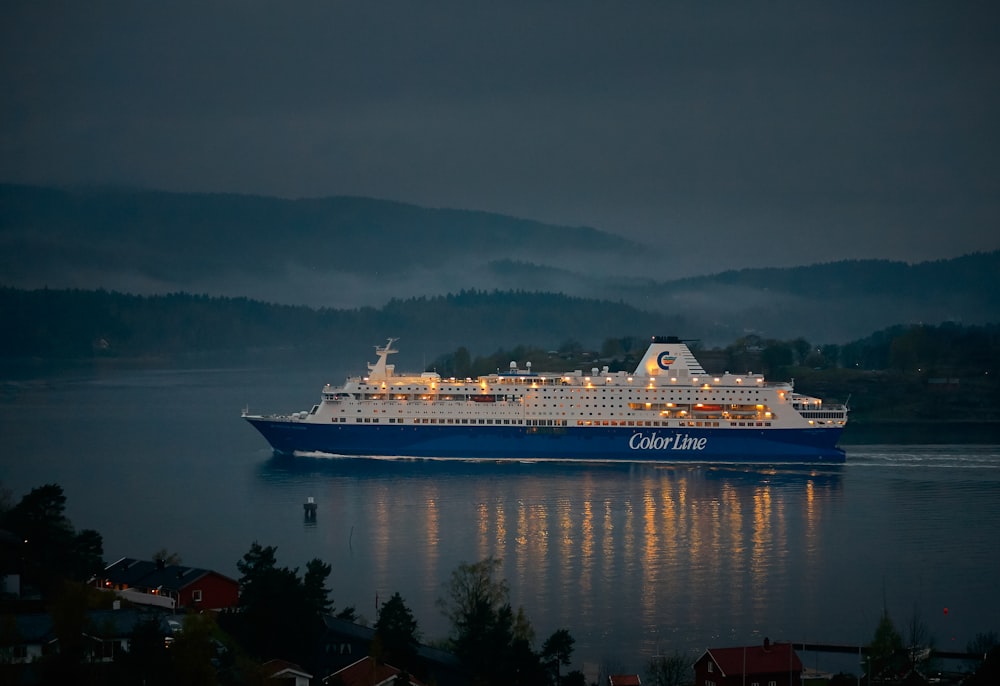 white and blue cruise ship