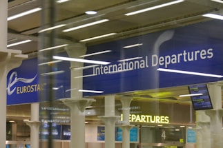 white internal departures signage