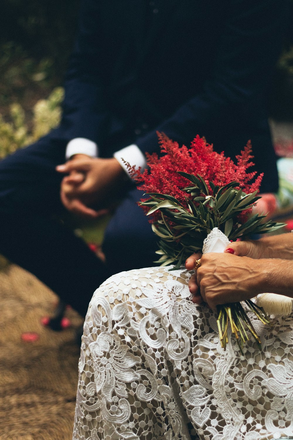 woman holding red flowers