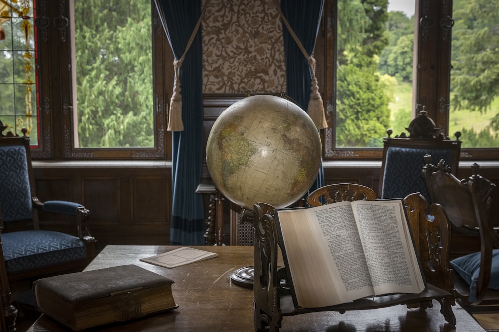 an open book sitting on top of a wooden table