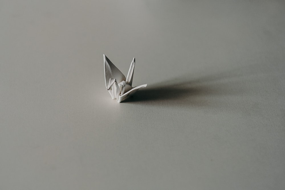 crane paper origami on panel