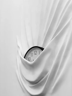 round white and black analog clock