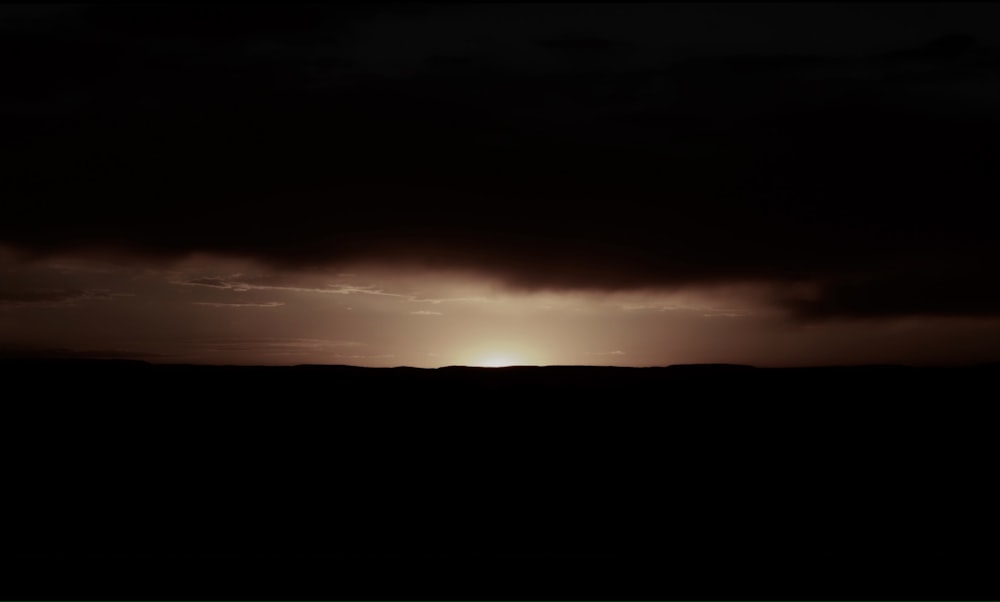 silhouette landscape photography of land and the sky