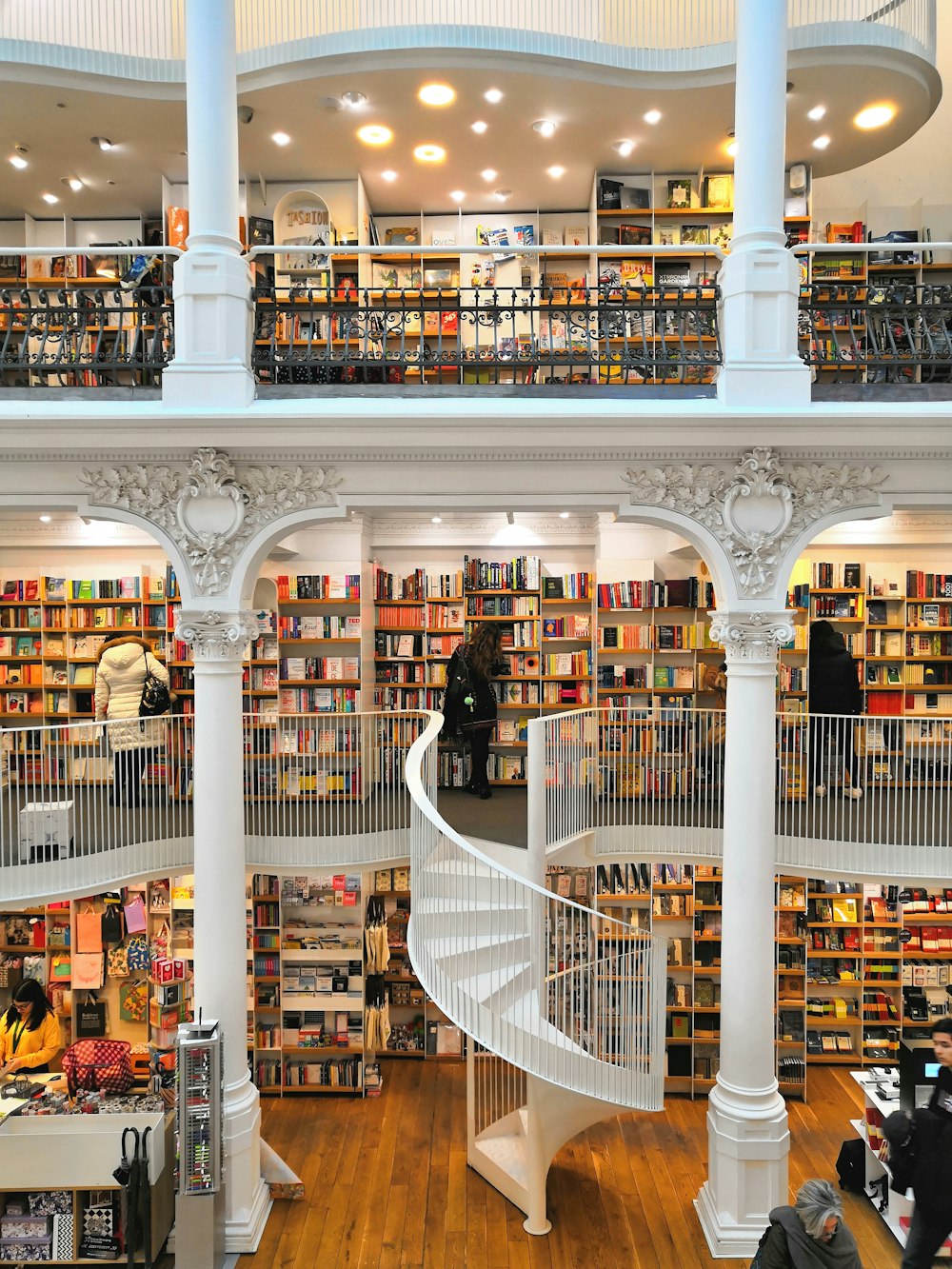 people in front of bookshelves