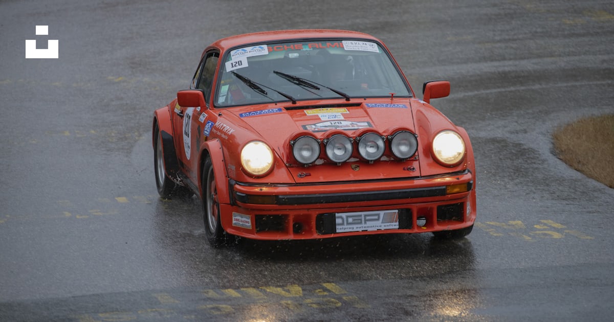 Red Porsche rally car on road photo – Free Historic Image on Unsplash