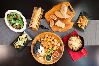 An assortment of fresh salads and appetizers on a serving tray.
