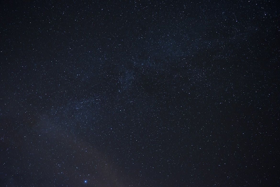 the night sky is filled with stars and bright lights