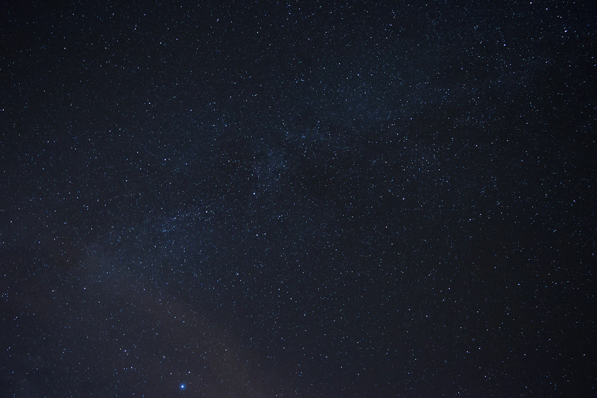 the night sky is filled with stars and bright lights