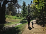 A peaceful family walk in a lush green park.