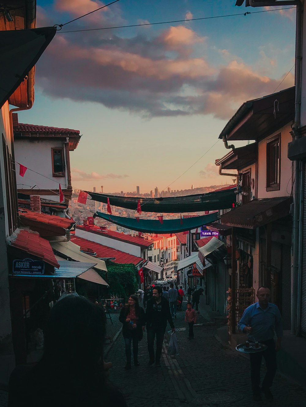 people walking on sidewalk during daytime